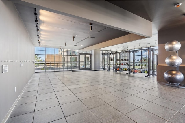 601 NE 1st Ave Unit 2703, Miami, FL 33132 - gym featuring rail lighting, expansive windows, and tile patterned flooring