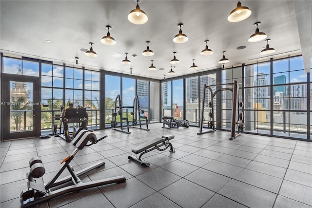 601 NE 1st Ave Unit 2703, Miami, FL 33132 - workout area with expansive windows, a view of skyline, and french doors