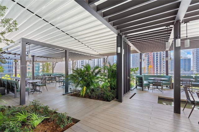 601 NE 1st Ave Unit 2703, Miami, FL 33132 - wooden terrace with outdoor dining space and a view of city