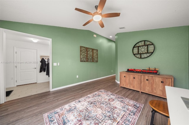 4728 Adrienne St, Sebring, FL 33872 - living area with ceiling fan, wood finished floors, and lofted ceiling