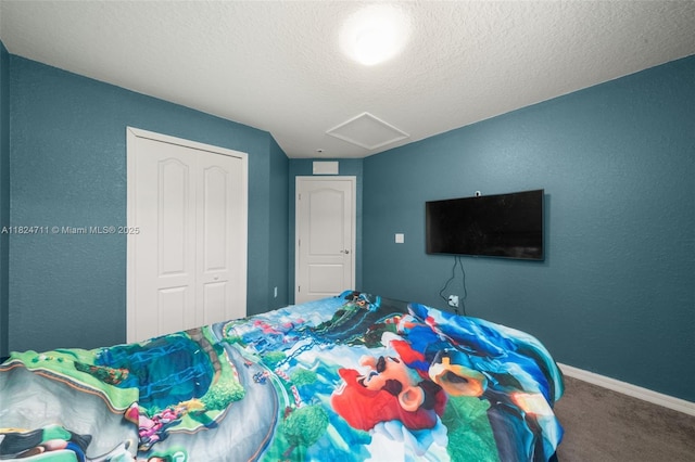 4728 Adrienne St, Sebring, FL 33872 - carpeted bedroom featuring attic access, a closet, a textured wall, and a textured ceiling