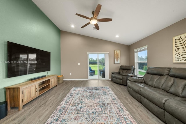 4728 Adrienne St, Sebring, FL 33872 - living room with lofted ceiling, a ceiling fan, wood finished floors, and recessed lighting