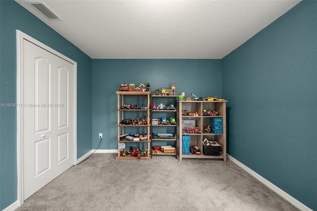 4728 Adrienne St, Sebring, FL 33872 - game room with carpet floors and a textured ceiling