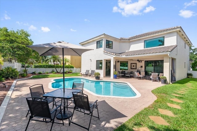1273 SW 161st Ave, Pembroke Pines, FL 33027 - rear view of house with stucco siding, ceiling fan, a tile roof, a fenced backyard, and a patio