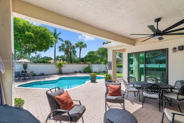 1273 SW 161st Ave, Pembroke Pines, FL 33027 - view of swimming pool with a fenced backyard, a patio area, a ceiling fan, and outdoor dining space