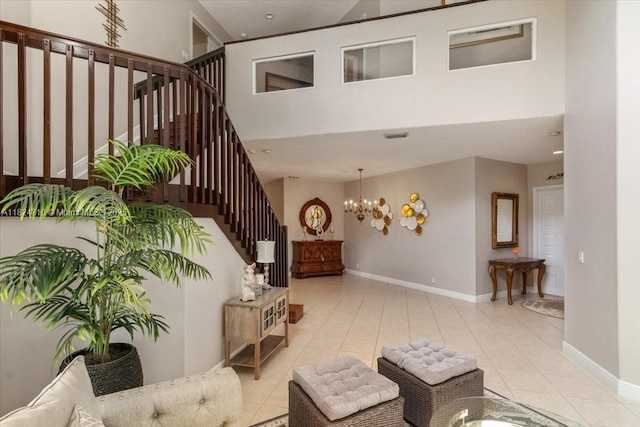 1273 SW 161st Ave, Pembroke Pines, FL 33027 - living room featuring stairway, a towering ceiling, tile patterned floors, and a chandelier