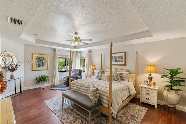 1273 SW 161st Ave, Pembroke Pines, FL 33027 - bedroom featuring a textured ceiling, a raised ceiling, wood finished floors, and ceiling fan