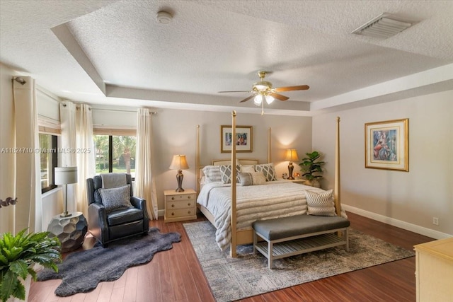 1273 SW 161st Ave, Pembroke Pines, FL 33027 - bedroom featuring a textured ceiling, wood finished floors, a raised ceiling, and ceiling fan