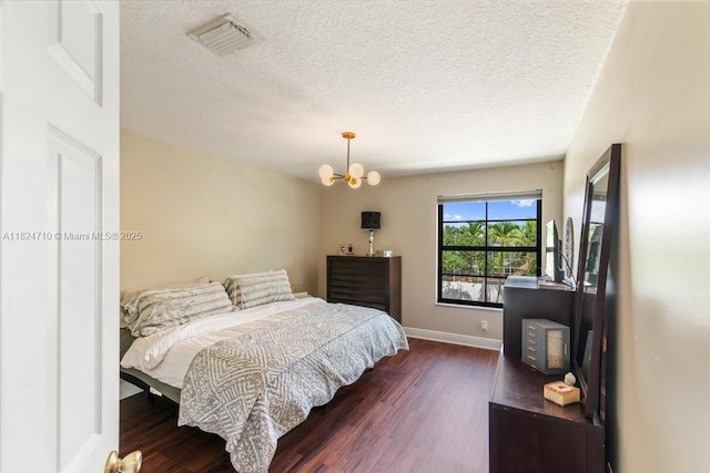 1273 SW 161st Ave, Pembroke Pines, FL 33027 - bedroom featuring wood finished floors, a textured ceiling, and a chandelier