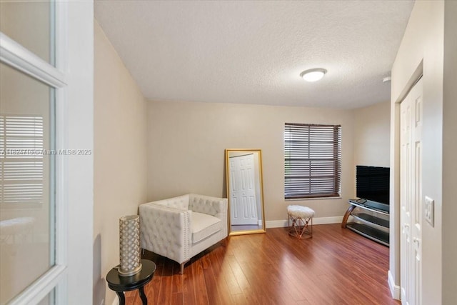1273 SW 161st Ave, Pembroke Pines, FL 33027 - sitting room with wood finished floors and a textured ceiling