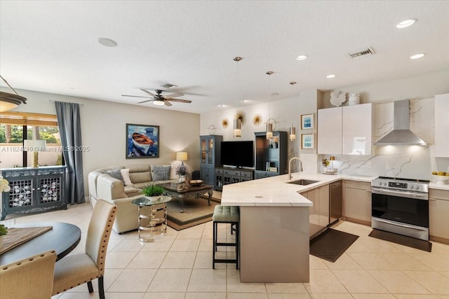 1273 SW 161st Ave, Pembroke Pines, FL 33027 - kitchen featuring stainless steel appliances, wall chimney range hood, a peninsula, open floor plan, and recessed lighting