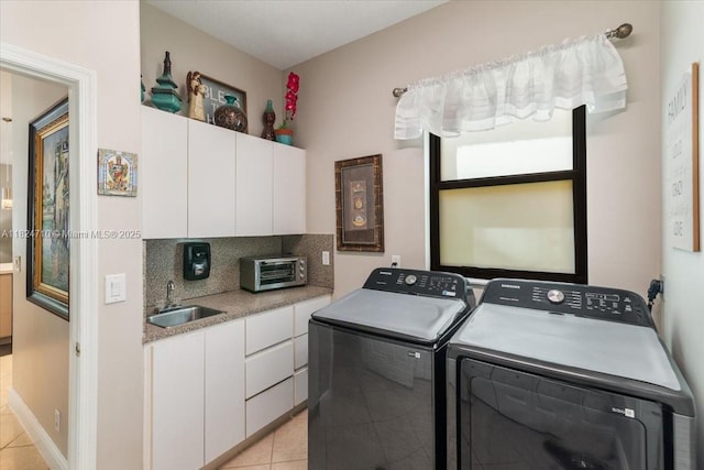 1273 SW 161st Ave, Pembroke Pines, FL 33027 - laundry area featuring washing machine and dryer, light tile patterned floors, and cabinet space