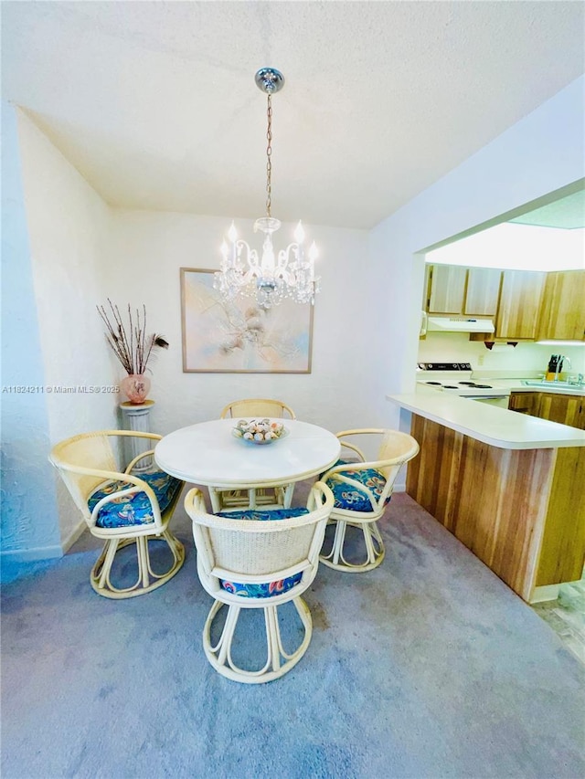 224 Pine Hov Cir Unit D-2, Green Acres, FL 33463 - dining area with light carpet and a chandelier