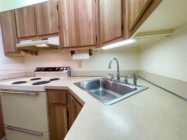 224 Pine Hov Cir Unit D-2, Green Acres, FL 33463 - kitchen with white electric range oven, under cabinet range hood, light countertops, and light brown cabinets