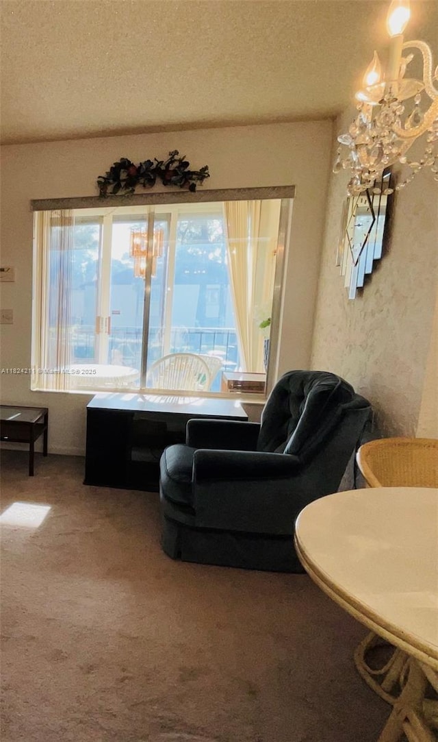 224 Pine Hov Cir Unit D-2, Green Acres, FL 33463 - sitting room with carpet, a textured ceiling, and a chandelier
