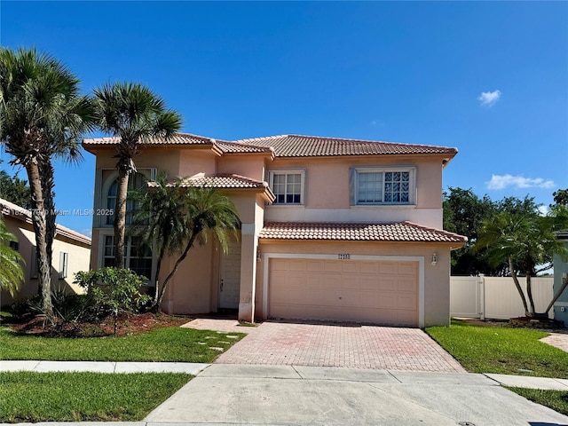 17088 NW 19th St, Pembroke Pines, FL 33028 - mediterranean / spanish-style home with a tiled roof, decorative driveway, a garage, and stucco siding