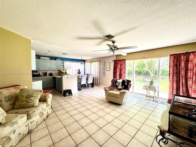 17088 NW 19th St, Pembroke Pines, FL 33028 - living room featuring light tile patterned floors, a ceiling fan, and a textured ceiling