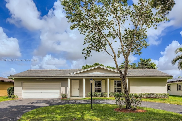 1708 NW 84th Dr, Coral Springs, FL 33071 - ranch-style home featuring driveway, stucco siding, an attached garage, and a front yard