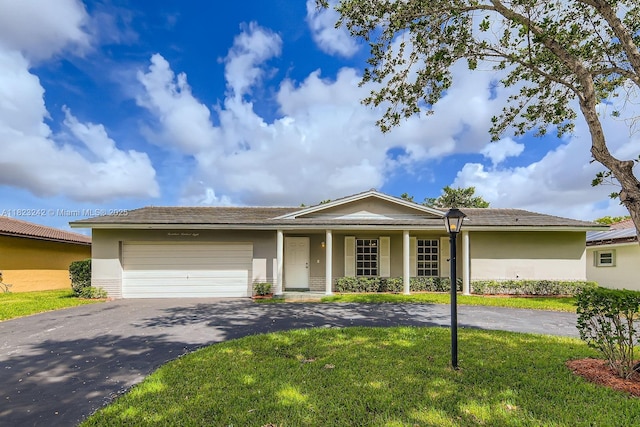 1708 NW 84th Dr, Coral Springs, FL 33071 - ranch-style home featuring asphalt driveway, a garage, a front lawn, stucco siding, and covered porch