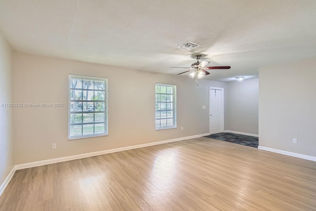 1708 NW 84th Dr, Coral Springs, FL 33071 - empty room featuring ceiling fan, wood finished floors, and a textured ceiling