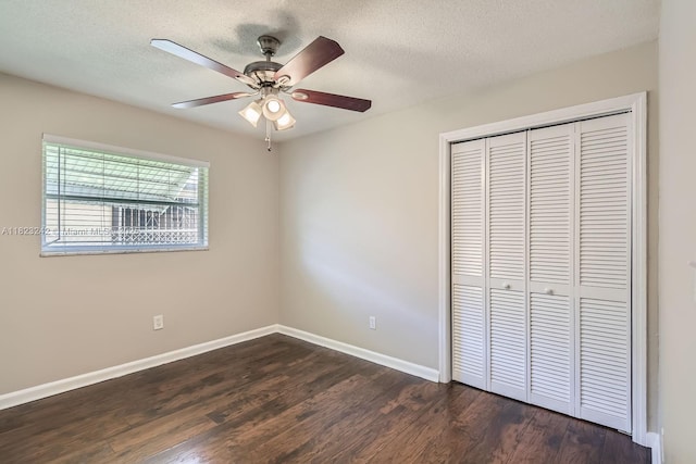 1708 NW 84th Dr, Coral Springs, FL 33071 - unfurnished bedroom with dark wood-type flooring, a closet, a textured ceiling, and a ceiling fan