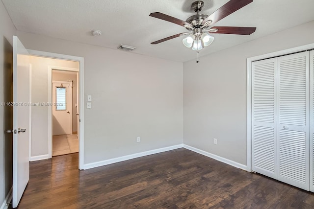 1708 NW 84th Dr, Coral Springs, FL 33071 - unfurnished bedroom with dark wood-style flooring, a closet, and a ceiling fan