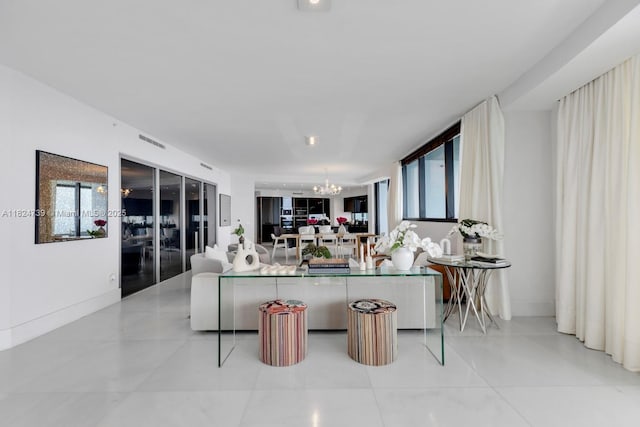 18555 Collins Ave Unit 4605, Sunny Isles Beach, FL 33160 - living area featuring a chandelier, healthy amount of natural light, and light tile patterned floors
