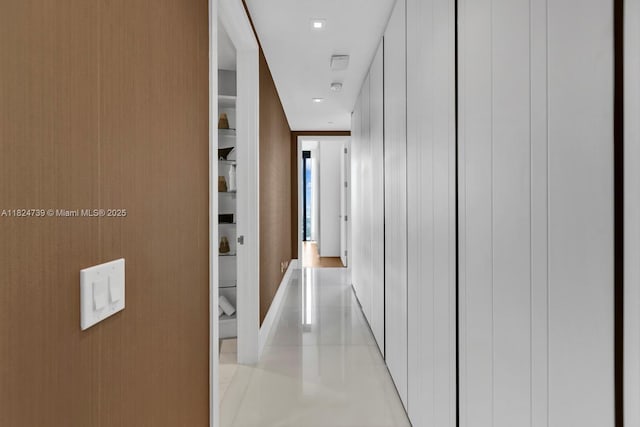 18555 Collins Ave Unit 4605, Sunny Isles Beach, FL 33160 - corridor with light tile patterned floors and baseboards