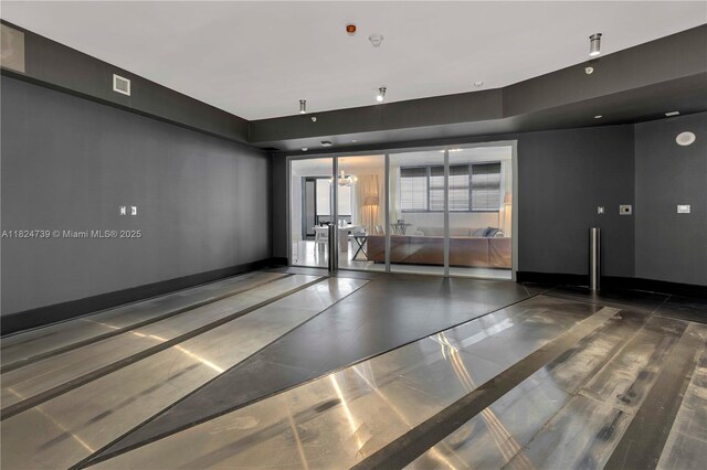 18555 Collins Ave Unit 4605, Sunny Isles Beach, FL 33160 - empty room featuring french doors and baseboards
