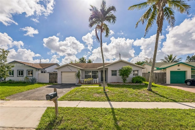 22226 SW 62nd Ave, Boca Raton, FL 33428 - ranch-style house with asphalt driveway, an attached garage, and stucco siding