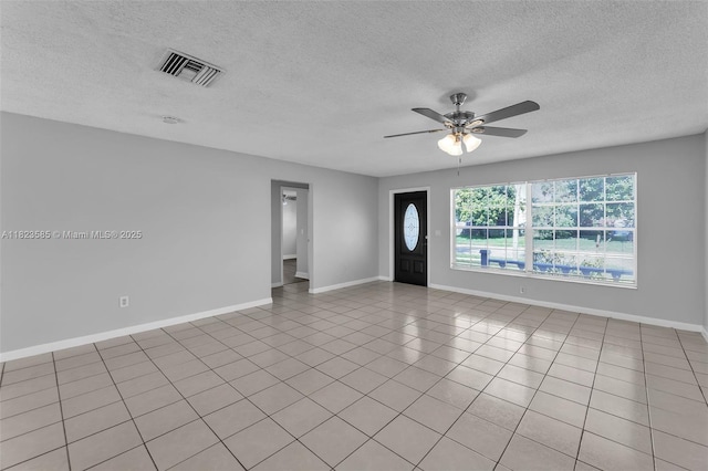 22226 SW 62nd Ave, Boca Raton, FL 33428 - unfurnished living room with a textured ceiling, ceiling fan, and light tile patterned floors