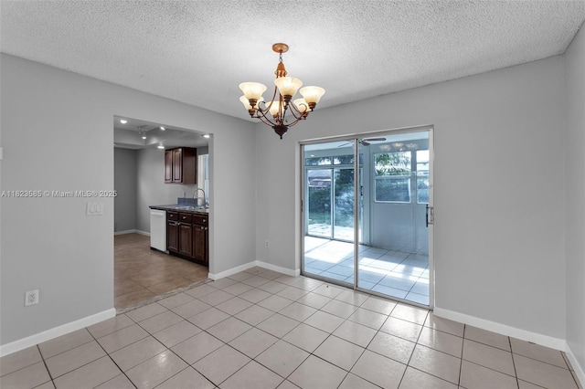 22226 SW 62nd Ave, Boca Raton, FL 33428 - unfurnished room with a chandelier, light tile patterned floors, and a textured ceiling