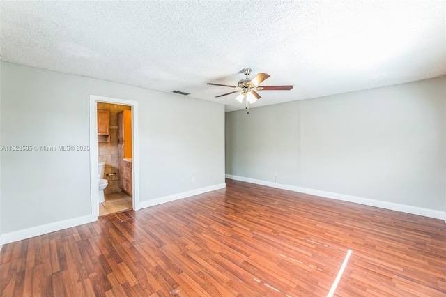 22226 SW 62nd Ave, Boca Raton, FL 33428 - unfurnished room featuring a ceiling fan, wood finished floors, and a textured ceiling