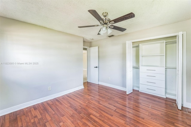 22226 SW 62nd Ave, Boca Raton, FL 33428 - unfurnished bedroom with wood finished floors, a closet, a textured ceiling, and a ceiling fan