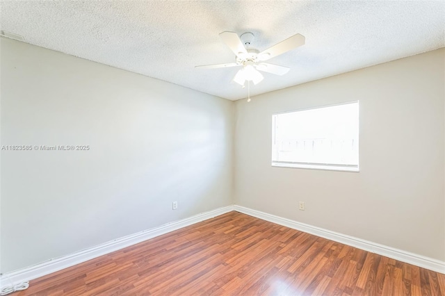 22226 SW 62nd Ave, Boca Raton, FL 33428 - empty room featuring wood finished floors, a ceiling fan, and a textured ceiling