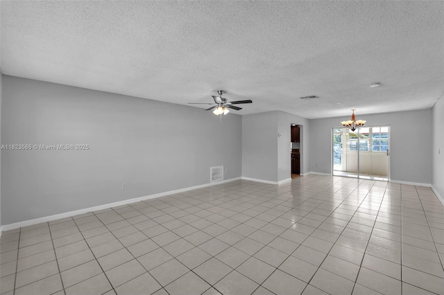 22226 SW 62nd Ave, Boca Raton, FL 33428 - spare room featuring a chandelier, ceiling fan, a textured ceiling, and light tile patterned floors