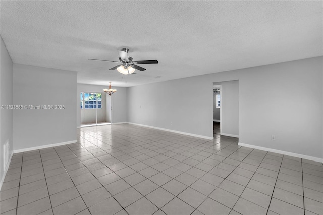 22226 SW 62nd Ave, Boca Raton, FL 33428 - spare room featuring a chandelier, ceiling fan, a textured ceiling, and light tile patterned floors