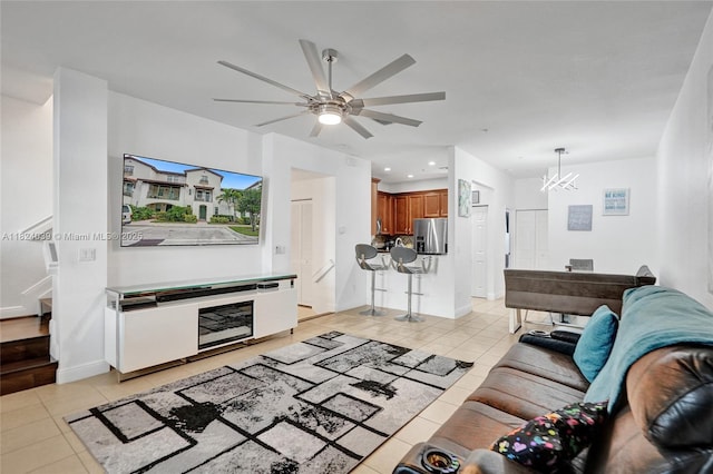 11854 SW 27th St, Miramar, FL 33025 - living area featuring light tile patterned flooring, a chandelier, ceiling fan, recessed lighting, and stairs