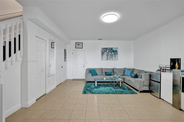 11854 SW 27th St, Miramar, FL 33025 - living room featuring light tile patterned floors and baseboards