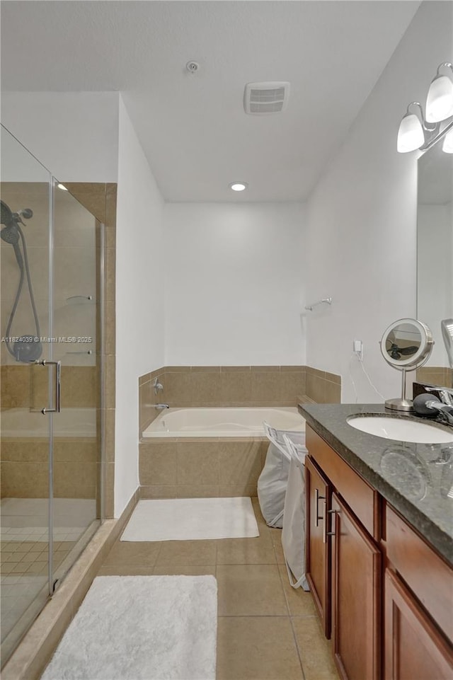 11854 SW 27th St, Miramar, FL 33025 - full bathroom with a garden tub, vanity, tile patterned flooring, and a stall shower