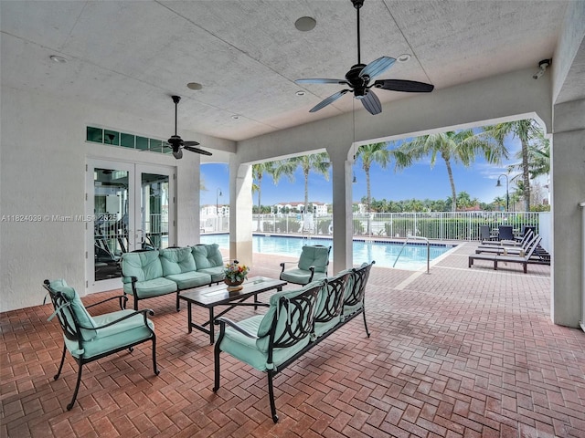 11854 SW 27th St, Miramar, FL 33025 - view of patio / terrace with french doors, ceiling fan, a community pool, and an outdoor living space