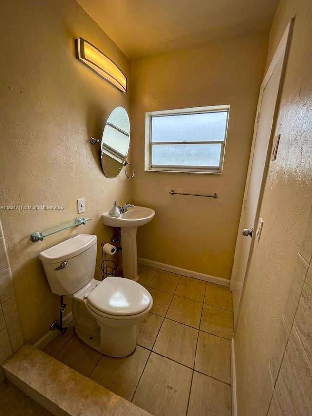 3515 Van Buren St Unit 106, Hollywood, FL 33021 - bathroom with toilet and tile patterned floors