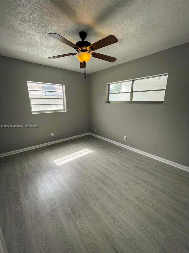 3515 Van Buren St Unit 106, Hollywood, FL 33021 - unfurnished room with wood finished floors, a textured ceiling, and ceiling fan