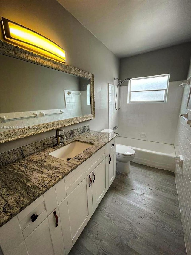 3515 Van Buren St Unit 106, Hollywood, FL 33021 - bathroom with shower / bathtub combination, vanity, and wood finished floors