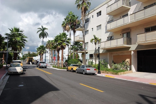 701 Euclid Ave Unit 403, Miami Beach, FL 33139 - view of asphalt road featuring traffic signs, sidewalks, curbs, and street lights