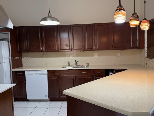 651 NW 134th Ave, Miami, FL 33182 - kitchen with white appliances, light countertops, decorative light fixtures, light tile patterned floors, and wall chimney range hood