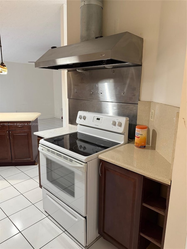651 NW 134th Ave, Miami, FL 33182 - kitchen featuring white electric range oven, wall chimney range hood, light countertops, dark brown cabinetry, and light tile patterned flooring