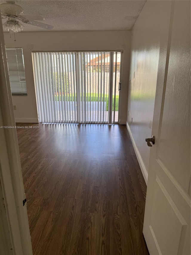 651 NW 134th Ave, Miami, FL 33182 - empty room with wood finished floors, a ceiling fan, and a textured ceiling
