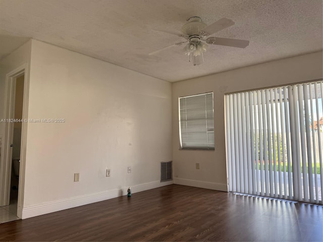 651 NW 134th Ave, Miami, FL 33182 - unfurnished room with wood finished floors, ceiling fan, and a textured ceiling