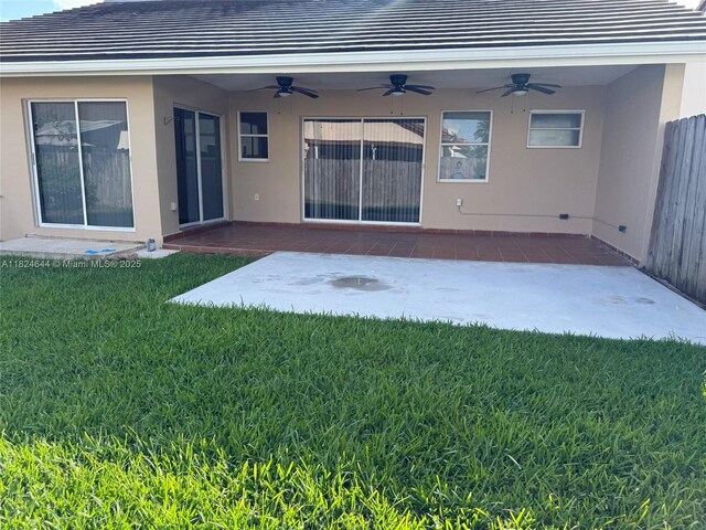 651 NW 134th Ave, Miami, FL 33182 - rear view of house with ceiling fan, a patio, and stucco siding